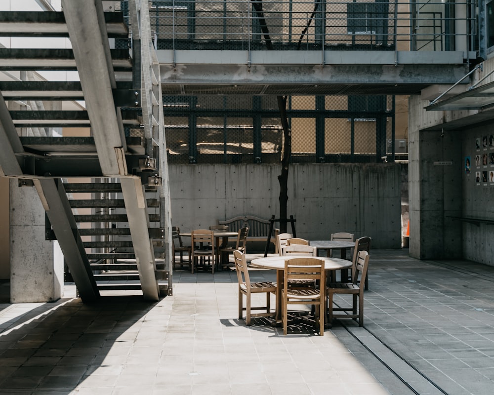 brown wooden chairs and tables inside building