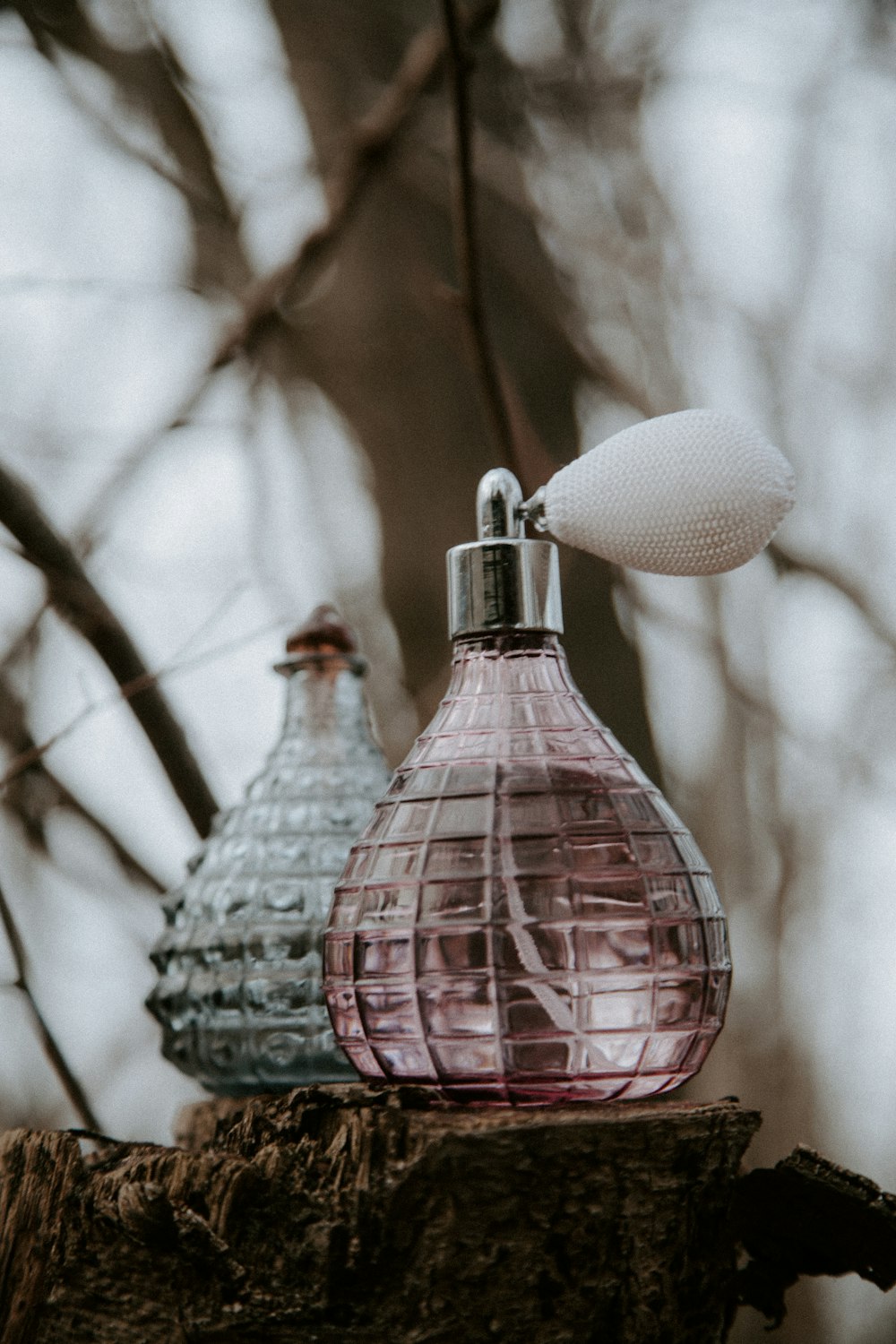 pink and white glass bottle