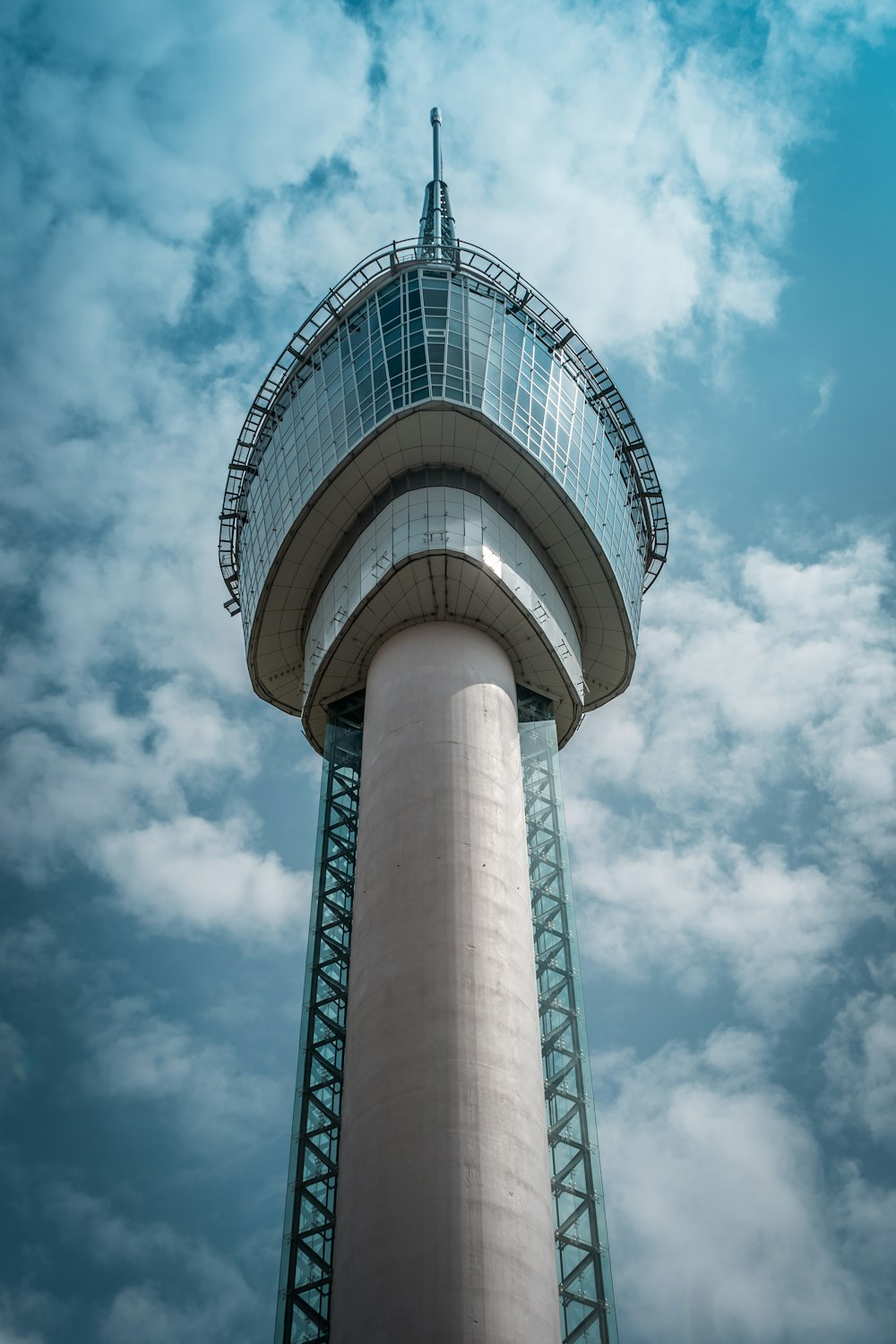 white and brown round building under blue sky