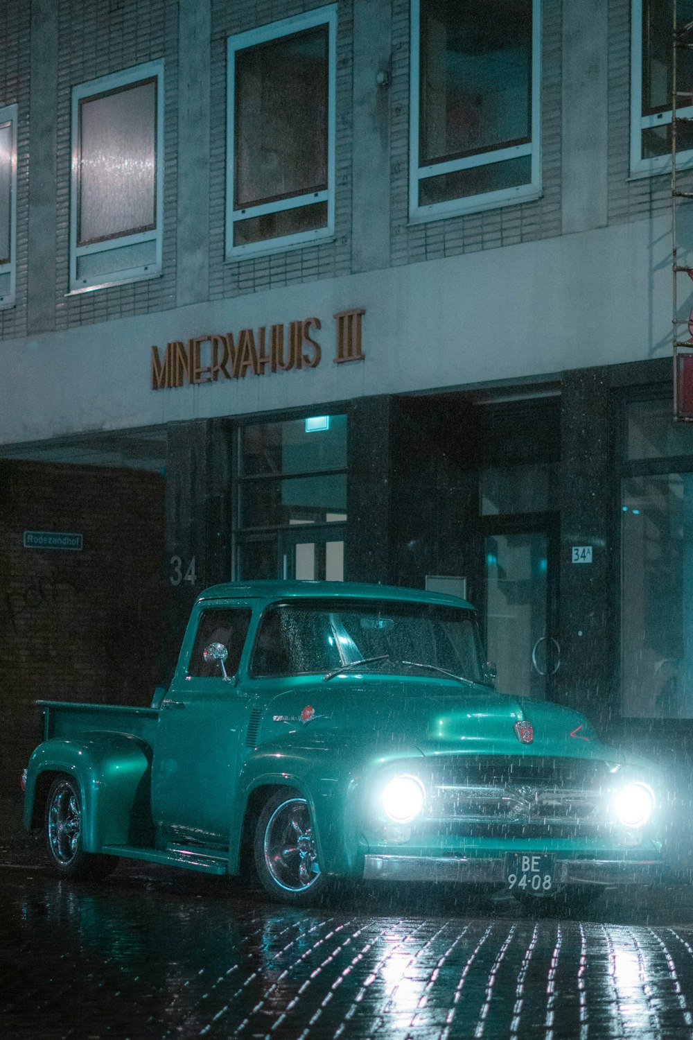 blue chevrolet crew cab pickup truck parked beside store