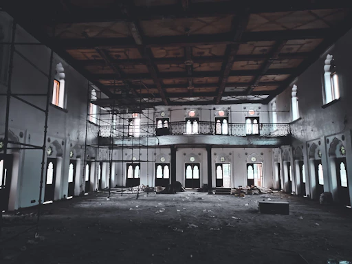 A warm, inviting parish hall with volunteers working together on renovations.