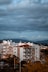 white and brown concrete building under gray sky