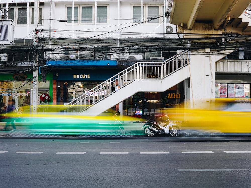 blue and yellow car on road during daytime