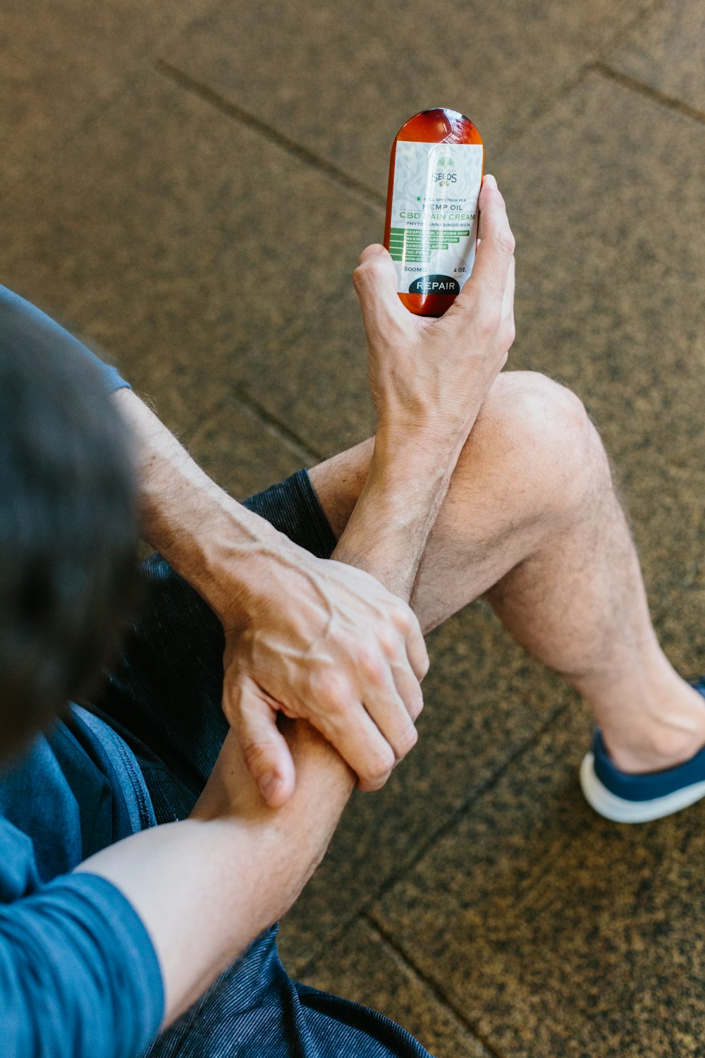 person holding white labeled bottle