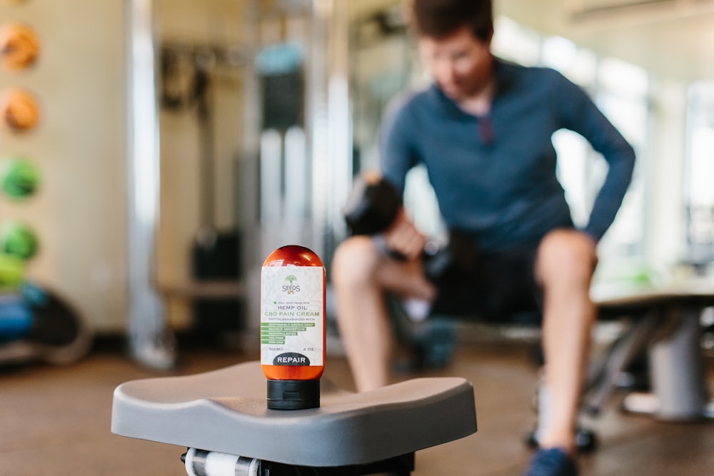 selective focus photography of white and red labeled bottle