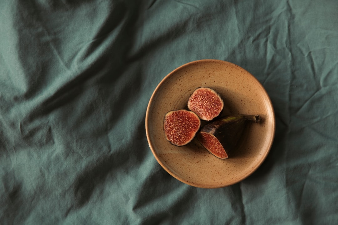 sliced fruit on brown round plate