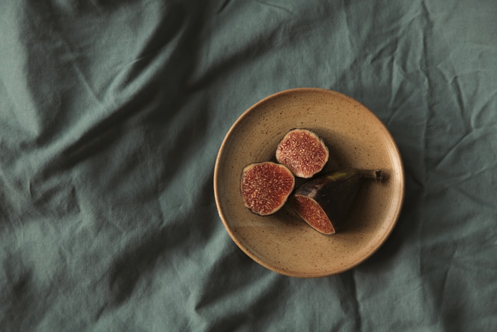 sliced fruit on brown round plate