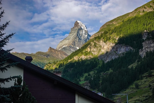 brown and green mountains under blue sky during daytime in Matterhorn Switzerland