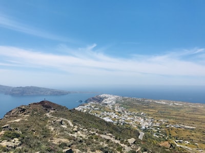 aerial view of city near mountain during daytime santorini google meet background