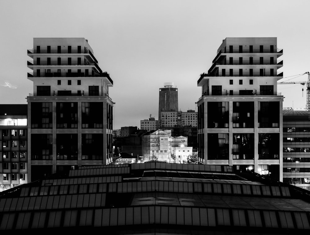 grayscale photo of city buildings