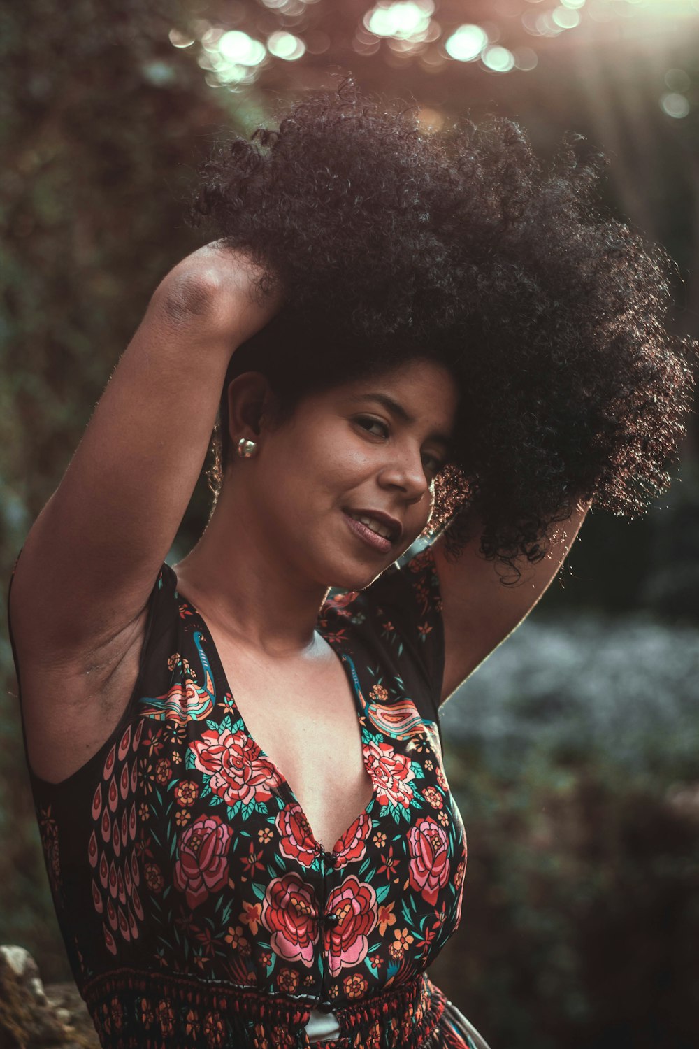 woman in red white and black floral tank top