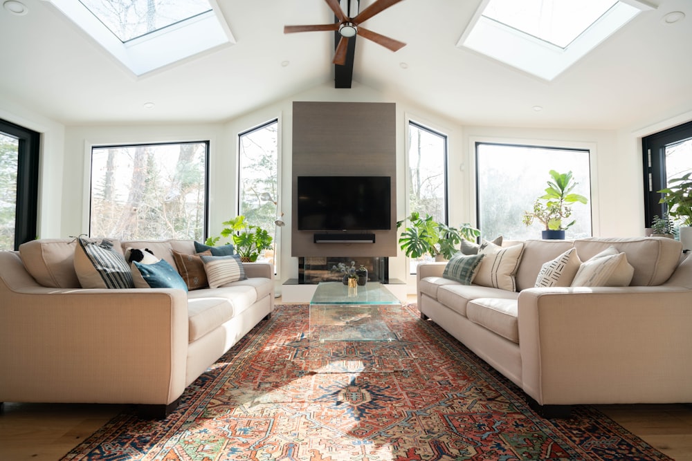 living room with white sofa and black flat screen tv