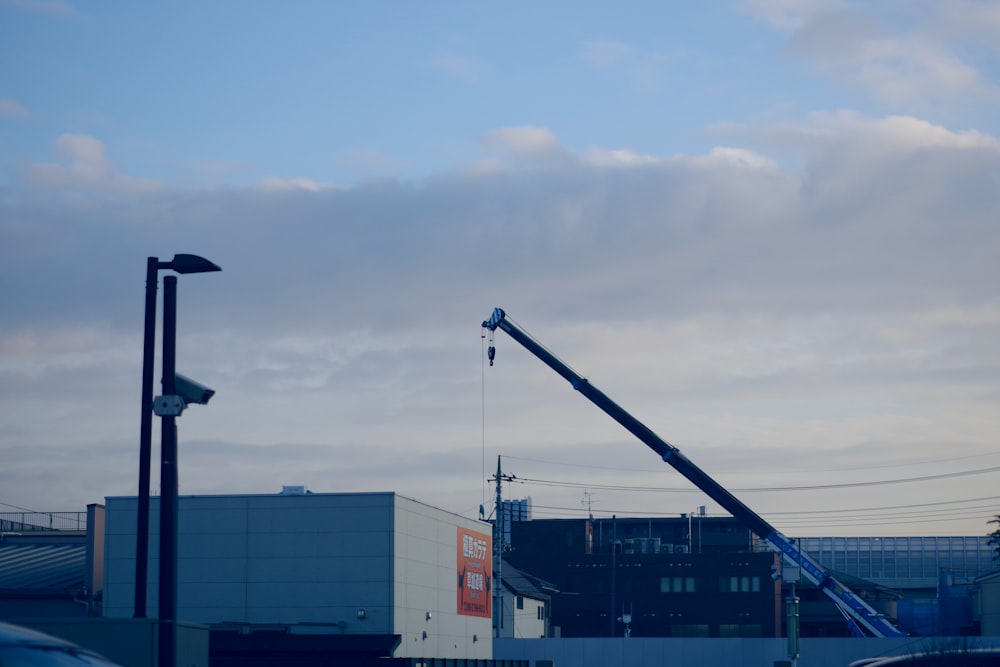 black crane near building during daytime