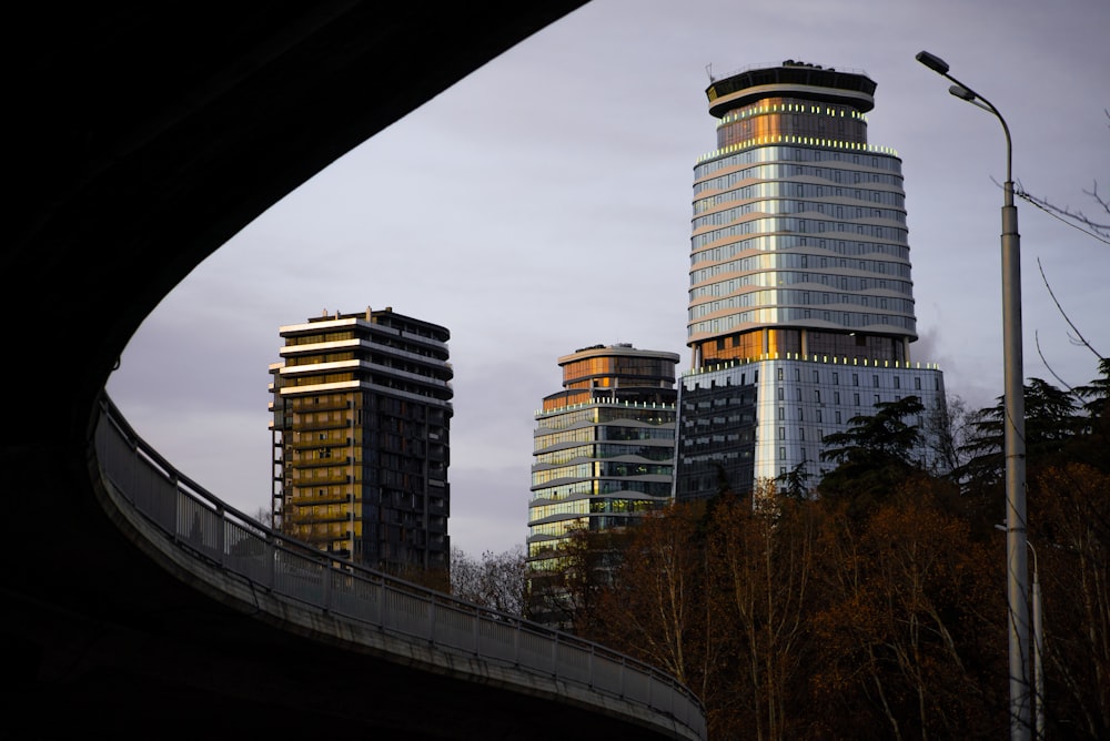 white and black concrete building near bridge during daytime