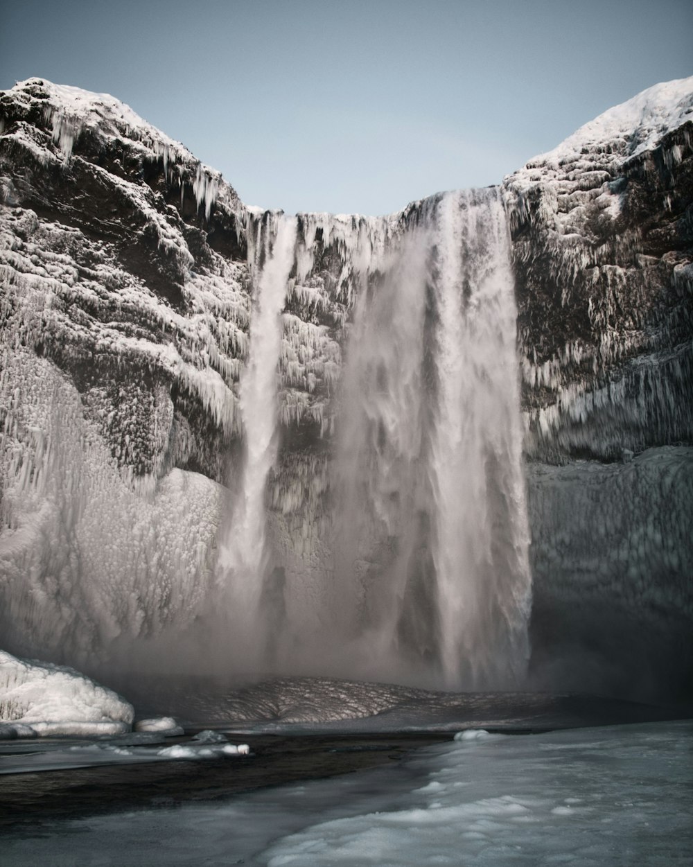 white ice formation on blue body of water during daytime