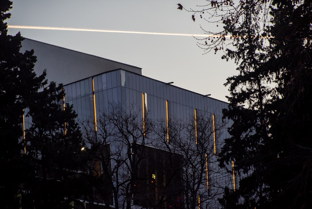 white concrete building near trees during daytime