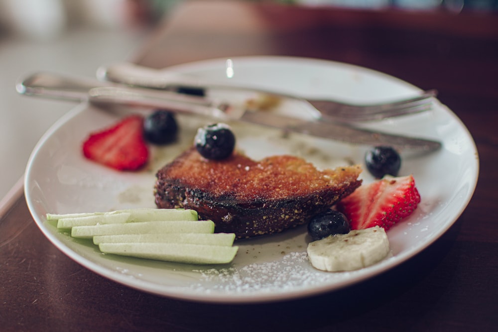 sliced cake on white ceramic plate