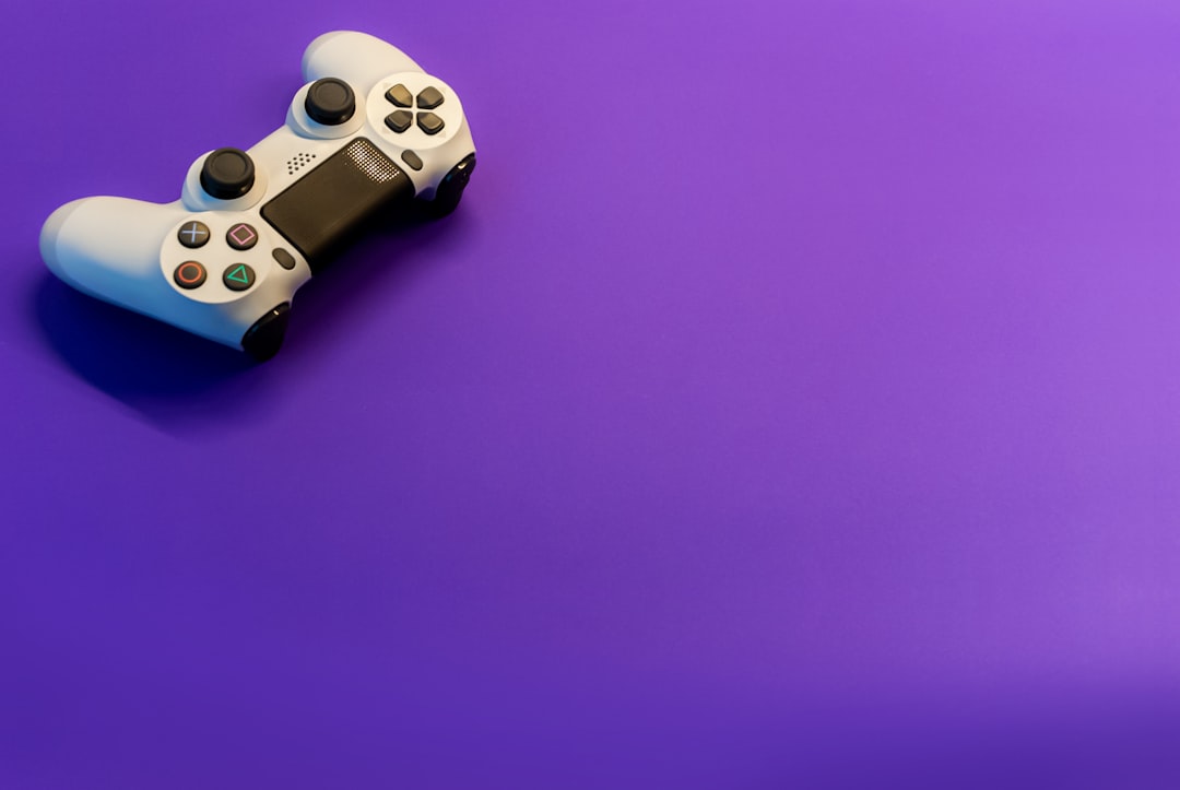 white and black game controller, white controller