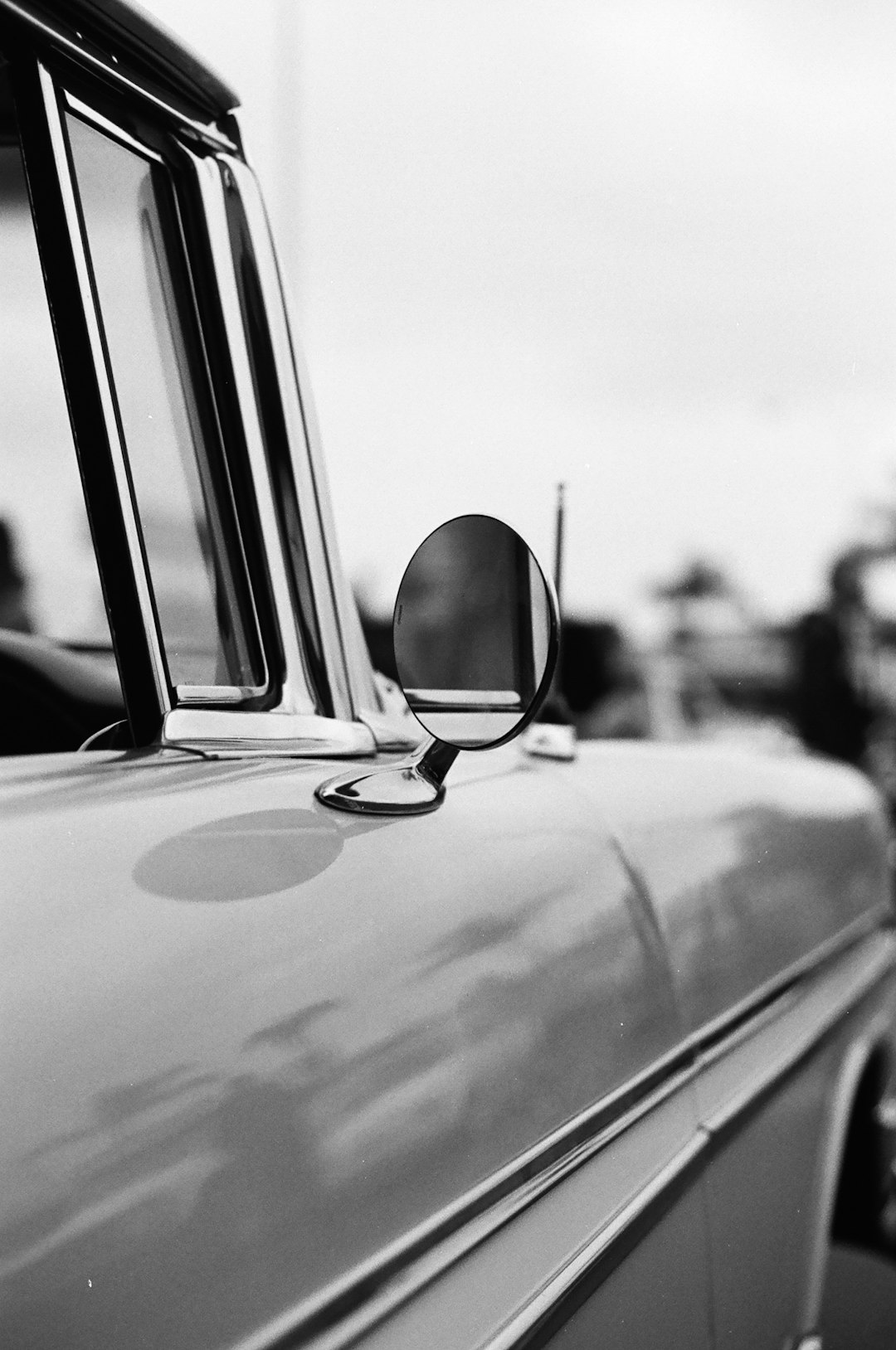 grayscale photo of car side mirror