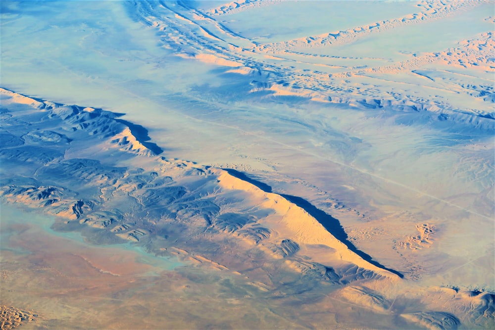 aerial view of snow covered mountains during daytime