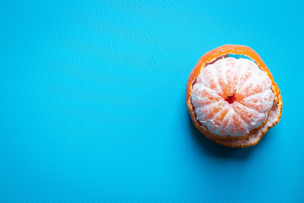 orange fruit on blue textile