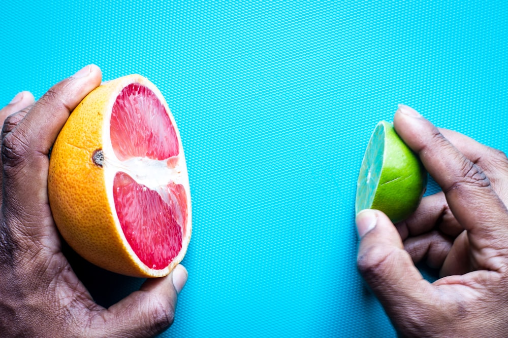 sliced lemon on blue textile