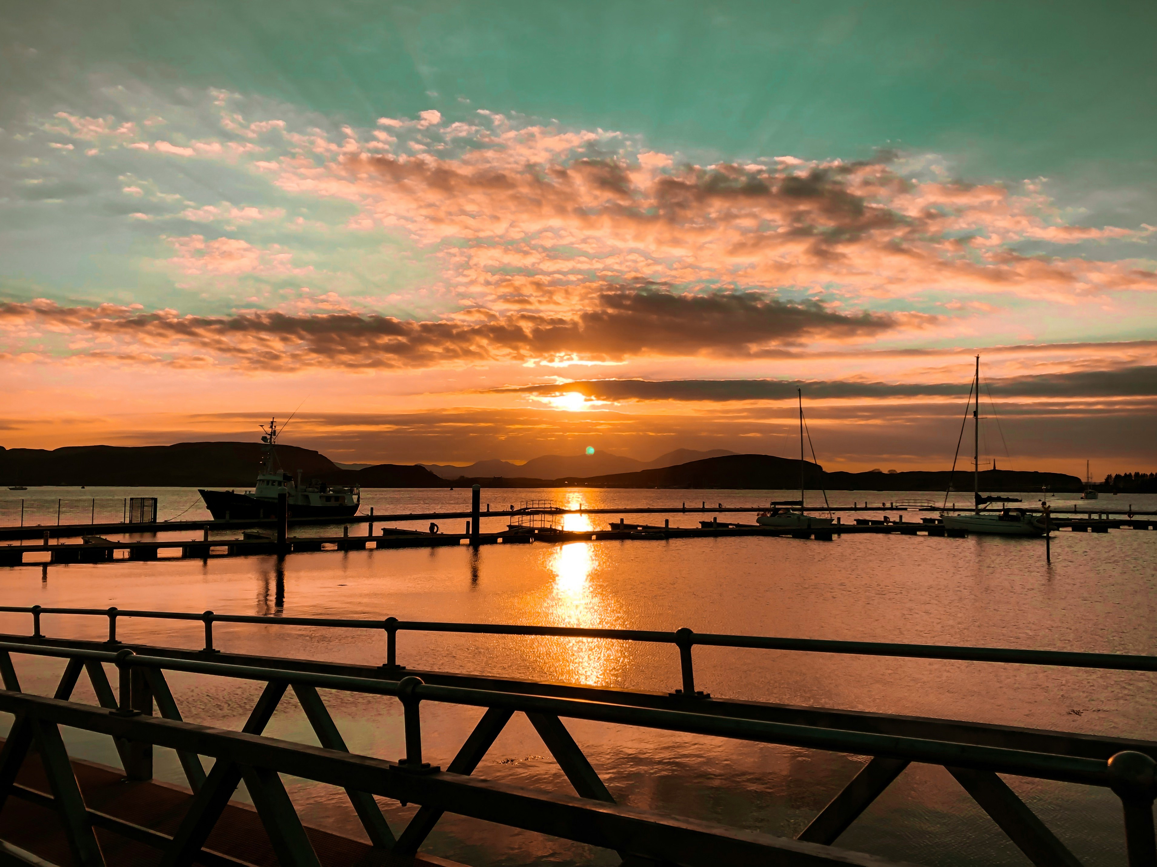 the harbor in Oban at sunset 