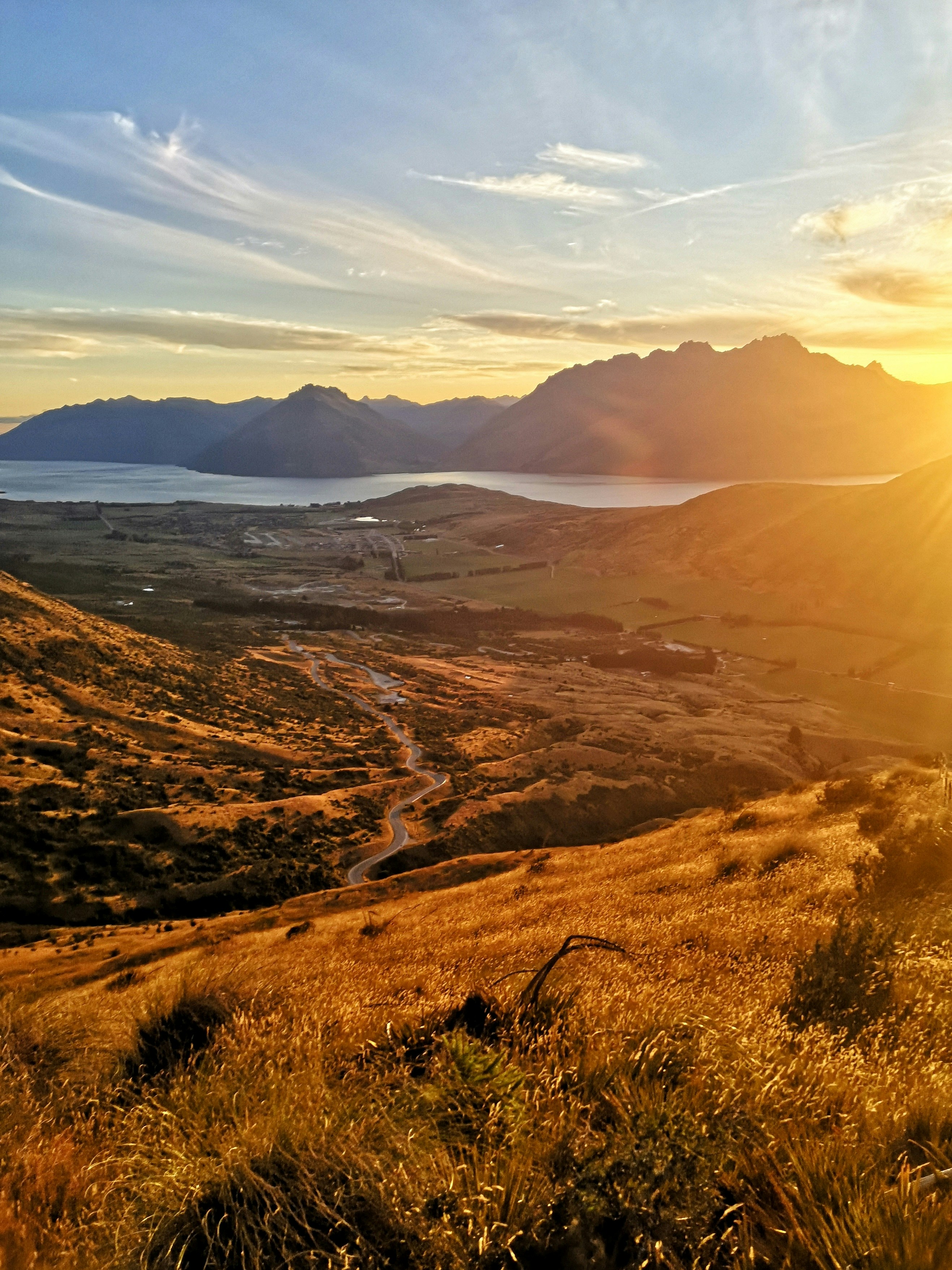 brown grass field near mountains during daytime
