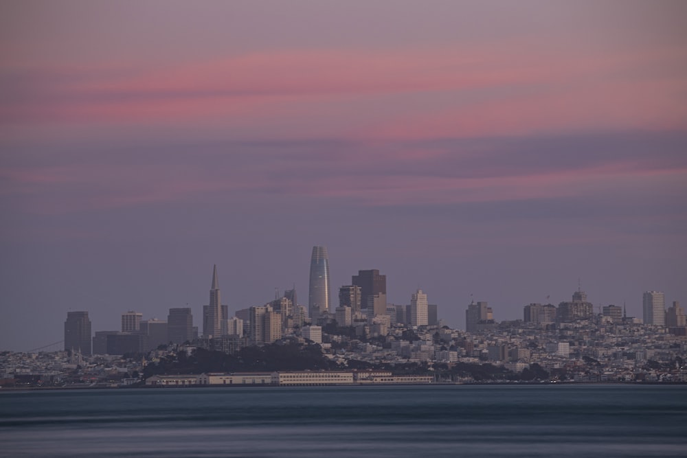 city skyline under orange sky