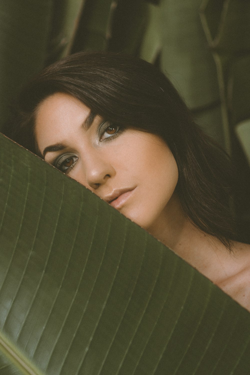 woman lying on green hammock