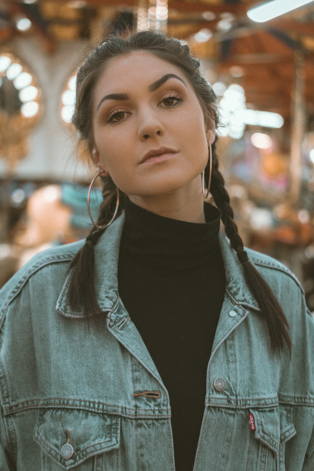 woman in black turtleneck shirt and blue denim jacket