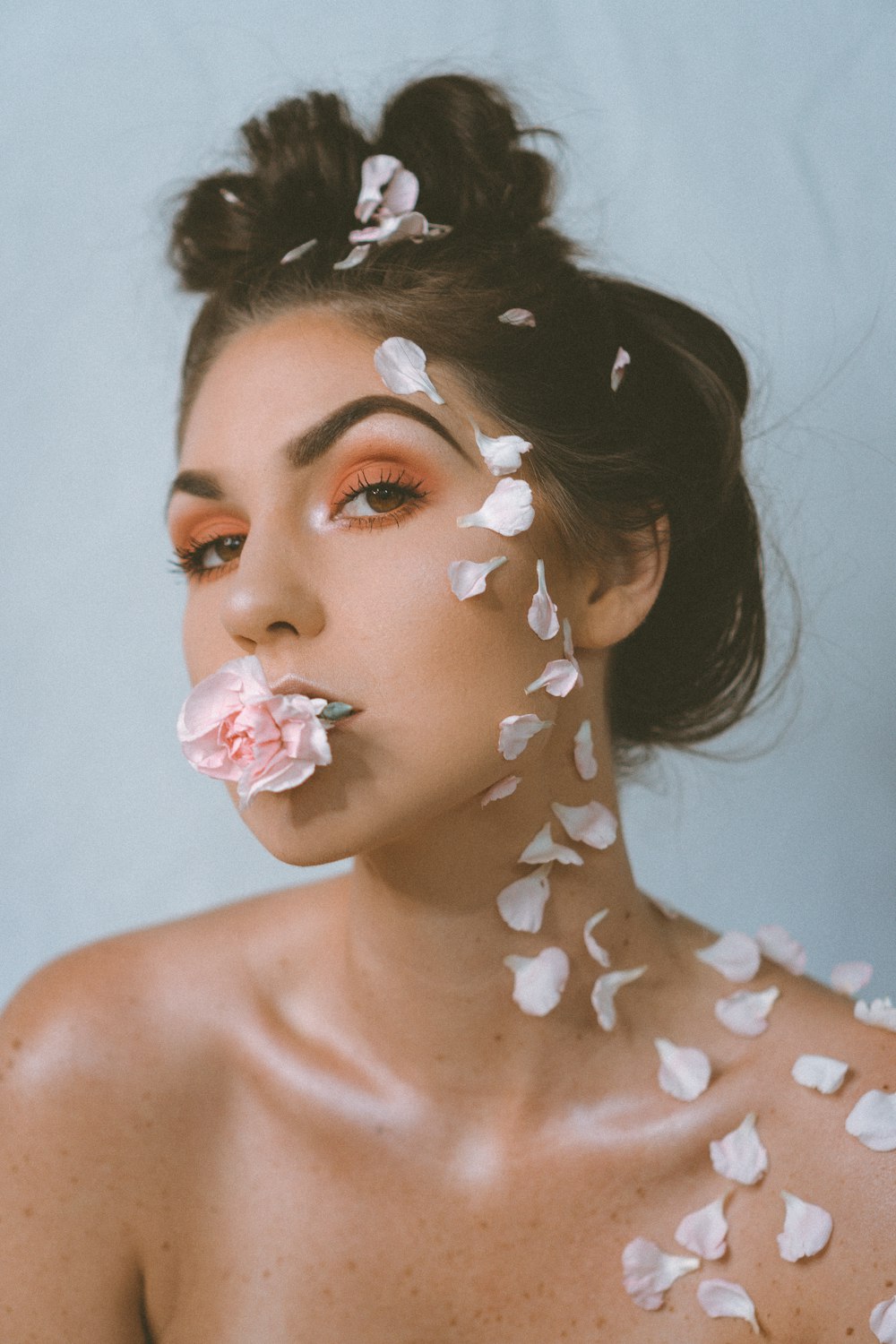 woman with white and brown star print on her face