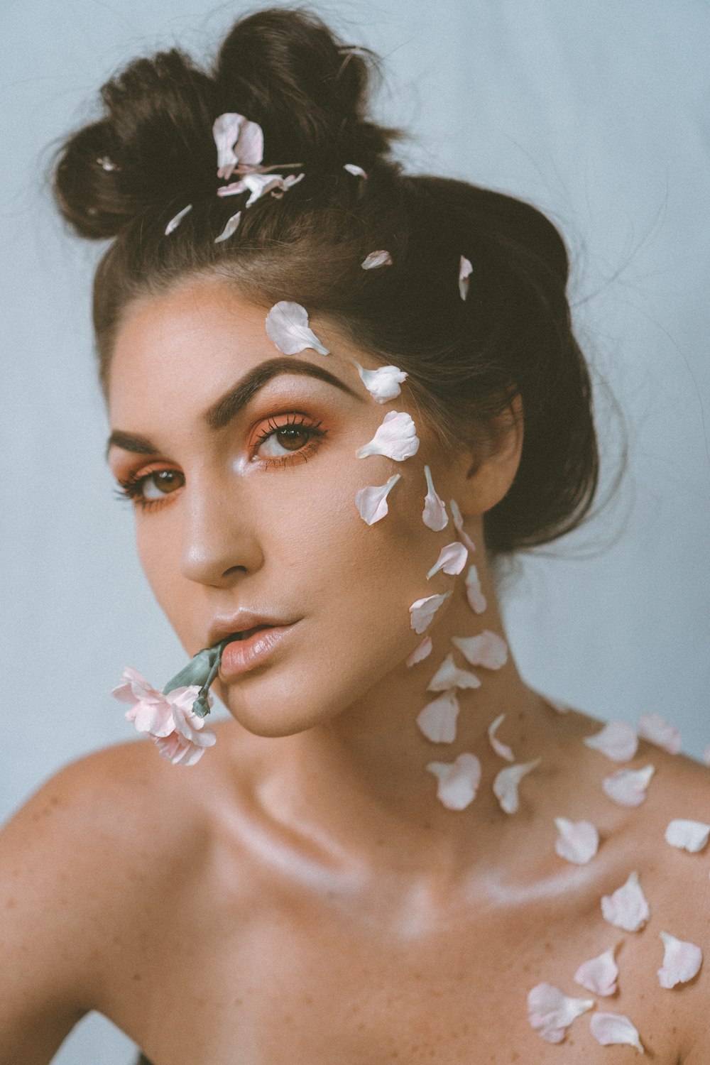 woman with white and brown floral face paint