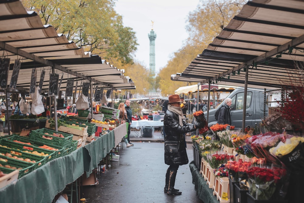 people walking on market during daytime