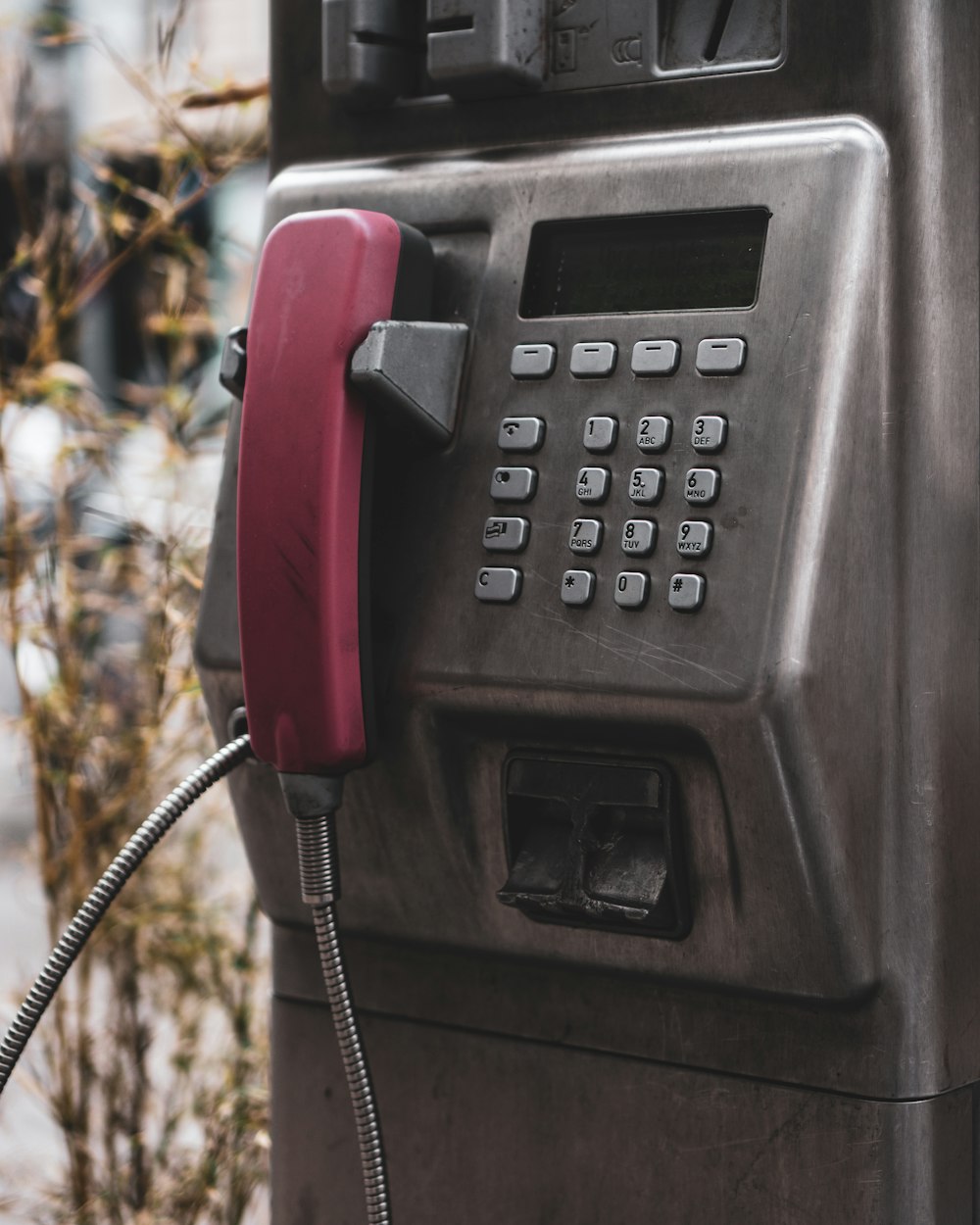 black and red telephone booth