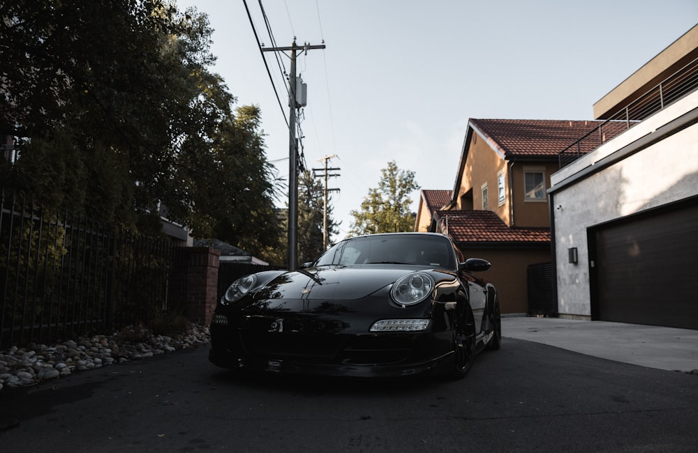 black bmw m 3 parked on sidewalk during daytime