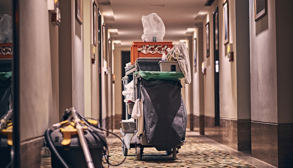 black and gray stroller on hallway