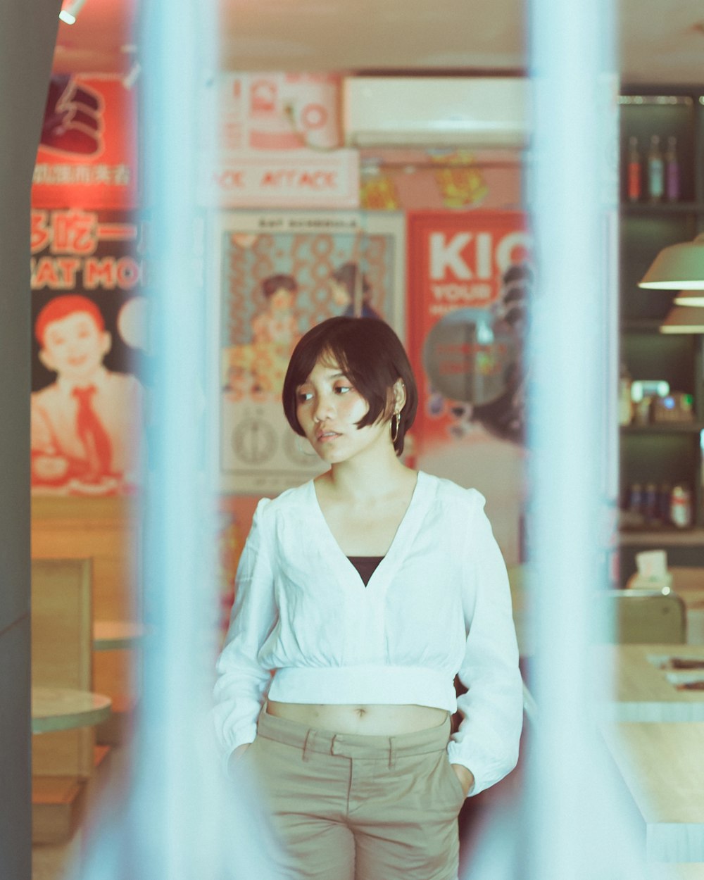 woman in white long sleeve shirt standing