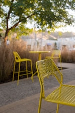 brown and white metal armchair on gray concrete floor during daytime