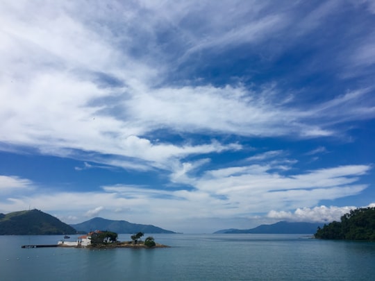 body of water under blue sky and white clouds during daytime in Angra dos Reis Brasil