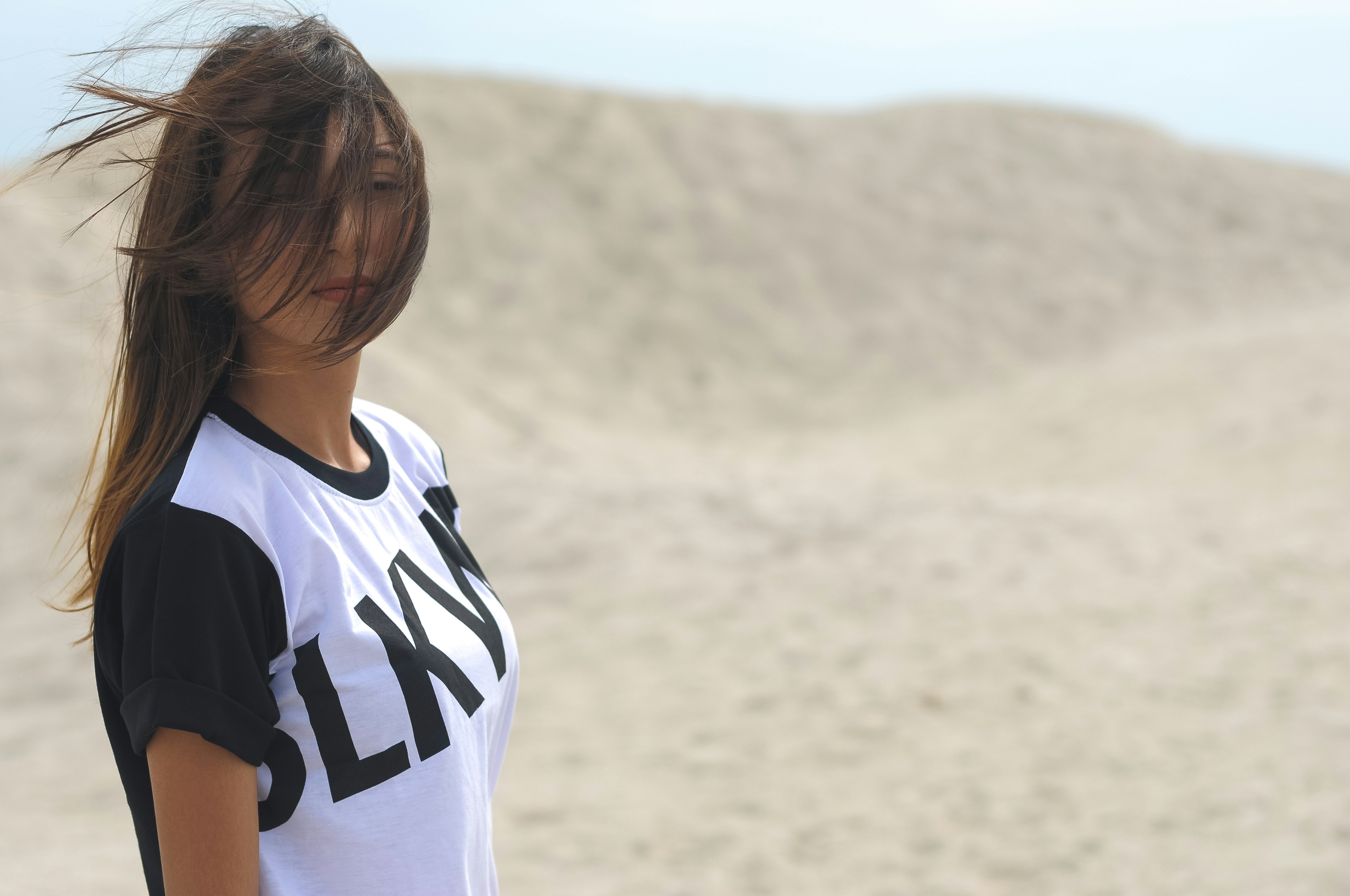 woman in white and black adidas t-shirt