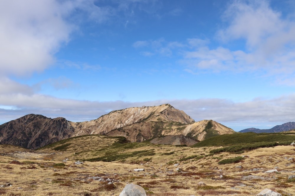 brown and green mountain under blue sky during daytime