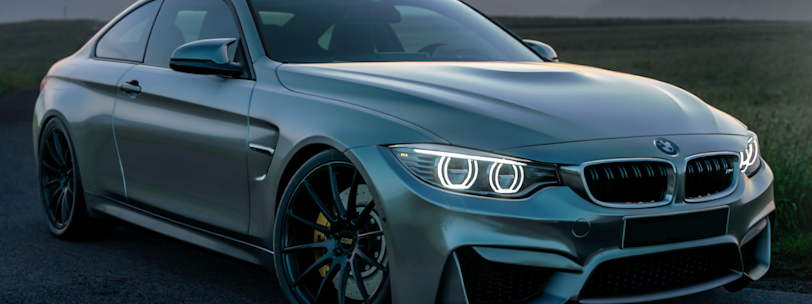 gray mercedes benz coupe on black asphalt road during daytime