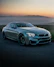 gray mercedes benz coupe on black asphalt road during daytime