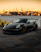 black porsche 911 on road during daytime