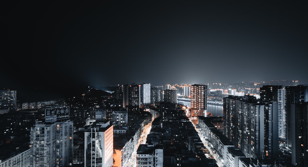 city with high rise buildings during night time