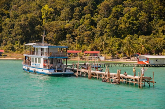 white and blue boat on blue sea during daytime in Koh Rong Sanloem Cambodia