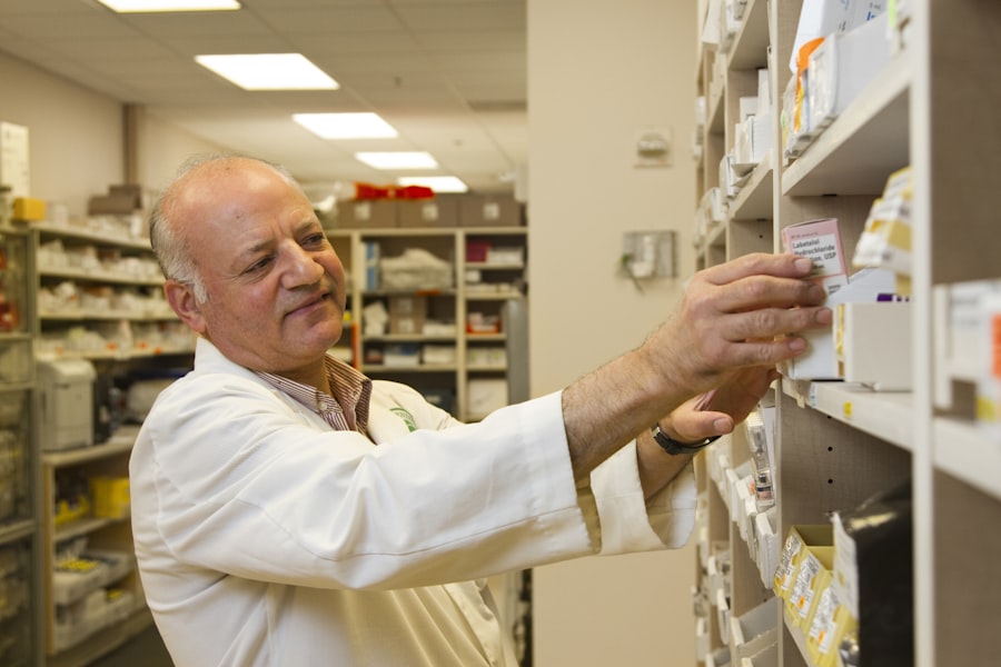 A pharmacist selecting a medication from the shelves