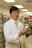 A satisfied customer holding a box of pharmaceutical products.