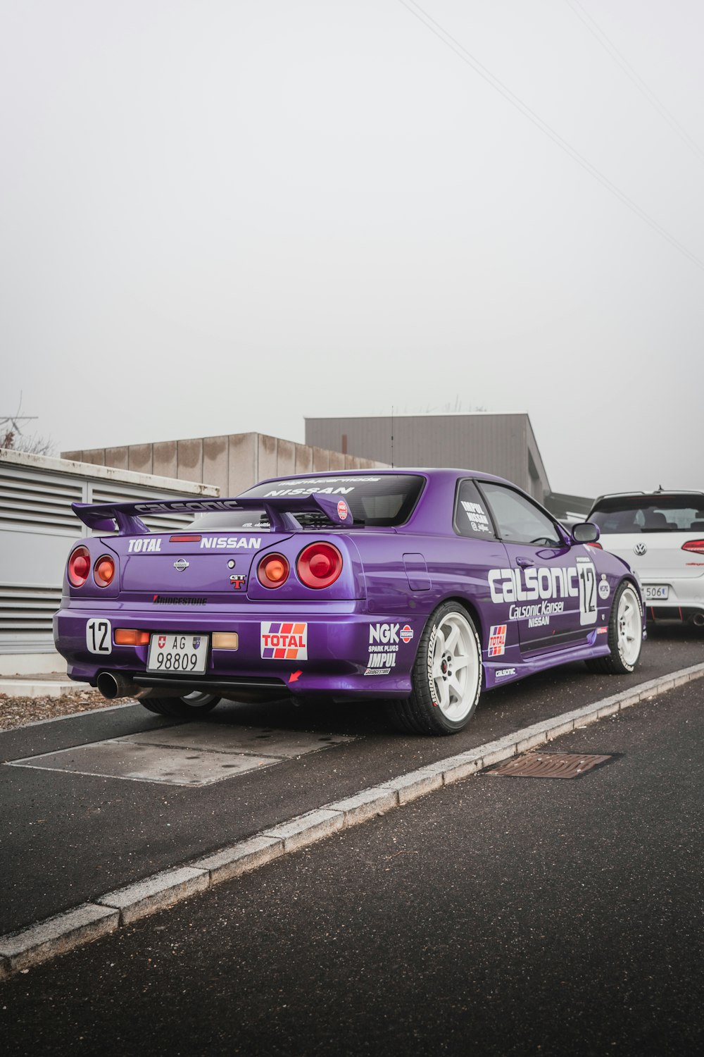 purple and black chevrolet camaro